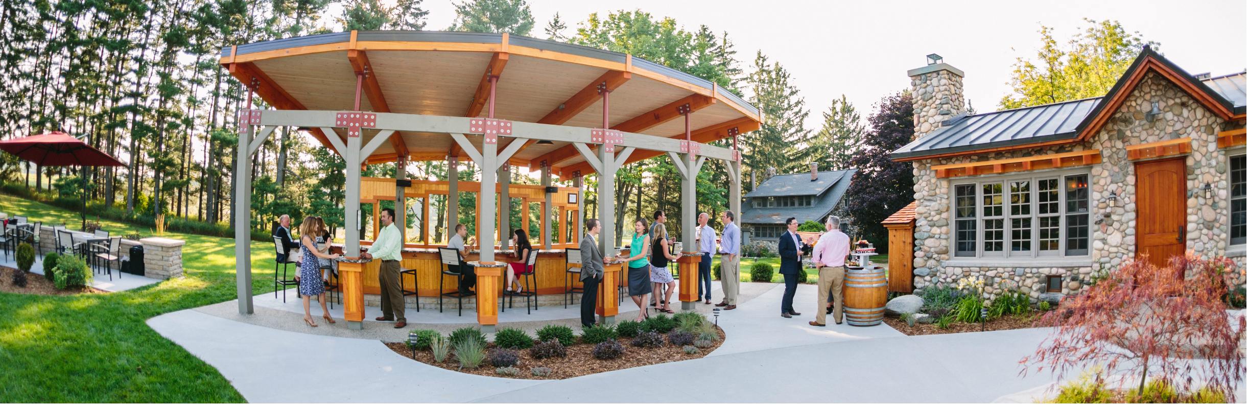 Guests enjoying wine at a scenic Leelanau Peninsula winery